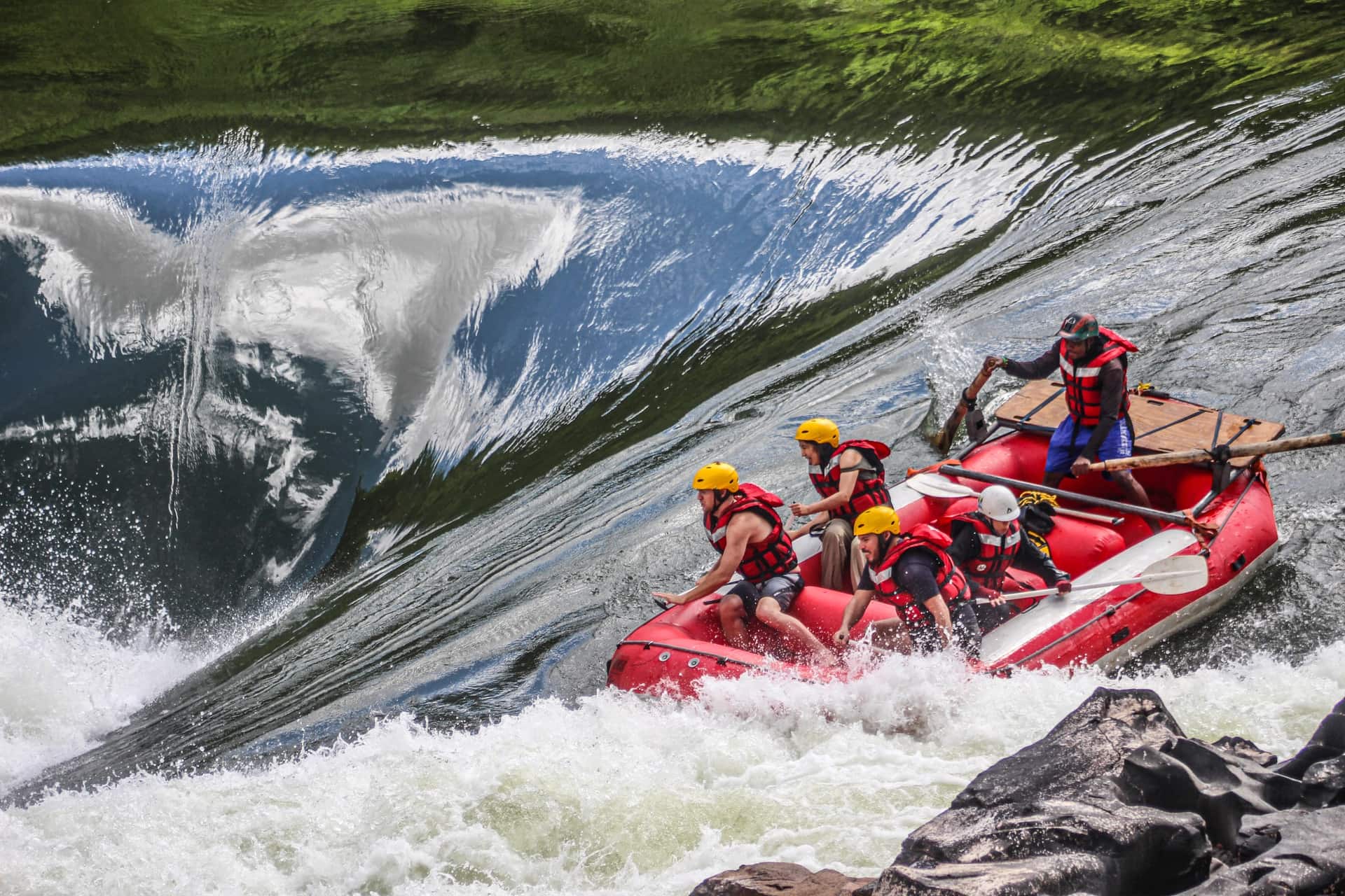 A team paddling through a rapid on the Zambezi